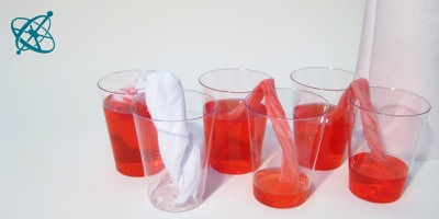 Sciensation hands-on experiment for school: A wick game ( chemistry, water, capillary action)